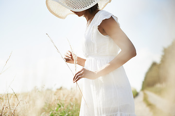 Image showing Sunshine, wheat field and woman with nature, grass and environment with break, weekend and landscape. Person, girl and traveller with freedom, exploring and plants with ecology, spring and summer