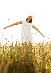 Image showing Smile, freedom and woman with open arms at field outdoor in the countryside in summer. Happy person in nature, eyes closed and relax at farm, breathe fresh air and enjoy vacation, travel and peace