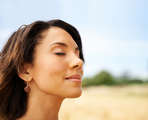 Image showing Relax, freedom or calm woman in a field in the countryside or outdoor garden in spring, park or nature. Zen, wellness or female person in farm to breathe in fresh air on holiday vacation or travel