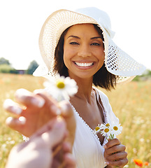 Image showing Portrait, flowers or pov of happy woman in a field, countryside or nature in summer to relax on break. Hands, wellness or biracial female person in a park or farm giving a plant or gift for love