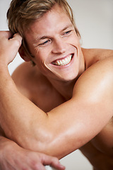 Image showing Face, smile and a shirtless man closeup in studio isolated on a gray background for heath or fitness. Skin, body and a happy young model looking satisfied with exercise or training for wellness