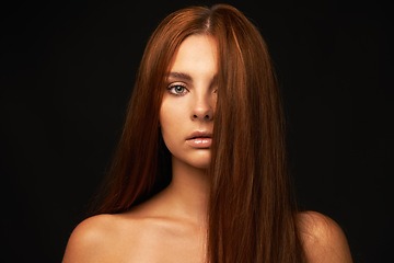 Image showing Hair care, portrait or woman with beauty, skincare or results for glow, shine or collagen in studio. Black background, face or serious model with cosmetics for treatment, healthy texture or growth