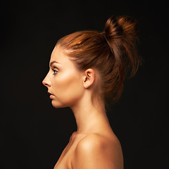 Image showing Hair care, profile or model with beauty space, skincare or results for glow, shine or collagen in studio. Black background, salon or natural woman with mockup for treatment, healthy texture or growth