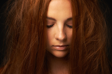 Image showing Depression, thinking or sad woman in studio with trauma stress, fail or bad results alone. Black background, psychology or face of a lonely female person with anger, messy hair or moody attitude