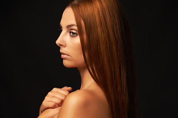 Image showing Hair care, ginger or woman thinking of beauty, skincare or results for glow, shine or collagen in studio. Black background, growth or serious model with cosmetics for healthy texture or textures
