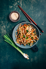 Image showing Spicy mung bean sprouts salad with garlic, sesame seeds, green onions, soy sauce, spices and red pepper. 