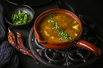 Image showing Hungarian hot goulash soup, beef, tomato, pepper, chili, smoked paprika soup. Traditional Hungarian dish.