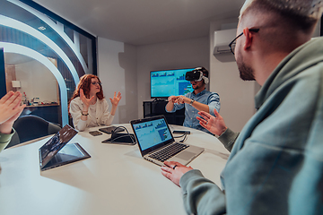 Image showing A diverse group of businessmen collaborates and tests a new virtual reality technology, wearing virtual glasses, showcasing innovation and creativity in their futuristic workspace