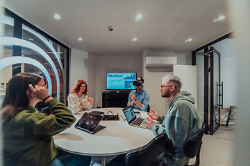 Image showing A diverse group of businessmen collaborates and tests a new virtual reality technology, wearing virtual glasses, showcasing innovation and creativity in their futuristic workspace