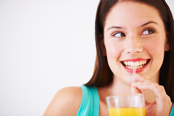 Image showing Happy, drinking and face of woman with juice for nutrition, wellness and hydration in studio. Beverage, smile and thirsty person with fruit blend for vitamins, detox and diet on white background