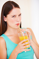 Image showing Health, drink and portrait of woman with juice for nutrition, wellness and hydration in studio. Happy, smile and face of person with fruit blend for vitamins, detox and diet on white background
