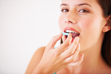 Image showing Healthy, woman and portrait with pill, tablet and supplements for nutrition, diet or vitamin c benefits. Happy, face and girl eating pharmaceutical capsule with omega 3, iron and healthcare medicine