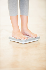 Image showing Woman, weight loss and feet on scale for measurement, goal and control diet for health and wellness. Fitness, scales and person measuring, check and weighing body, mass and electronic device or tech