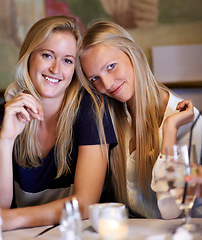 Image showing Portrait, women or friends in a cafe, smile or relax with happiness, bonding together or funny. Face, people or girls with conversation, cheerful or restaurant with gossip, sharing secret or speaking