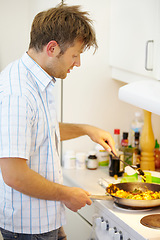 Image showing Man, stove and stir fry in home kitchen in profile for nutrition, health or preparation in pan. Chef person, cooking and spoon with vegetables for diet, wellness or vegan lunch with thinking in house