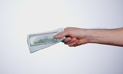 Image showing Hand, payment and closeup of money in a studio for retail shopping, paying bills or debt. Mockup, paper cash and zoom of person with dollar bank notes for buying products isolated by white background