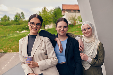 Image showing A group of professional businesswomen taking a break, sipping coffee and engaging in discussions, fostering a sense of empowerment and collaboration in the modern workplace.