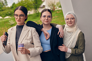 Image showing A group of professional businesswomen taking a break, sipping coffee and engaging in discussions, fostering a sense of empowerment and collaboration in the modern workplace.