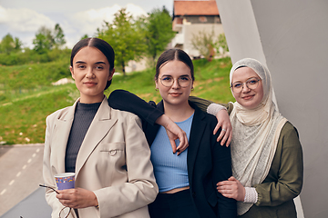 Image showing A group of professional businesswomen taking a break, sipping coffee and engaging in discussions, fostering a sense of empowerment and collaboration in the modern workplace.