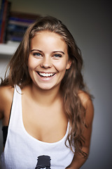 Image showing Happy, woman and portrait with laughing and modern casual clothing in a house with confidence. Youth, teen and relax young female person with gen z fashion style and funny joke with a teenager