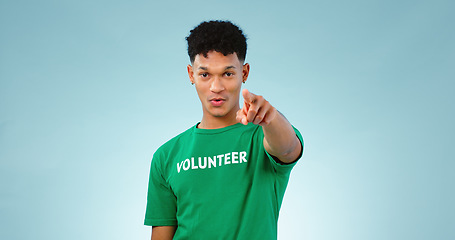 Image showing Portrait, man and pointing at you for volunteer in studio for climate change mockup on blue background in Cape Town. Young, male model and talking for support, decision and eco friendly for future