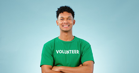 Image showing Happy man, volunteer and smile with portrait in studio for eco friendly mock up on blue background in Cape Town. Young person, model and excited for choice, prevention and climate change for future