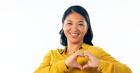 Image showing Portrait, love and heart hands with a young asian woman isolated on a white background in studio for health or wellness. Face, romance and satisfaction with a happy young person on valentines day