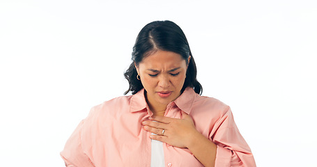 Image showing Chest pain, hands and woman in studio for heart attack, anxiety or emergency on white background. Stress, face and Japanese model with lung, asthma or breathing problem, fail or heartburn indigestion