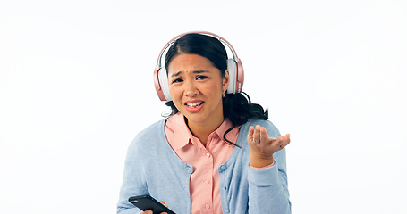Image showing Woman, confused and smartphone in portrait in headphones, music and streaming in question in studio mockup. Young person, asian and doubt on face, audio playlist and online radio by white background
