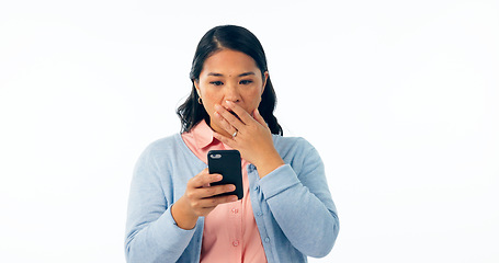 Image showing Phone, wow and woman in studio with emoji surprise for fake news, social media or chat on white background. Smartphone, notification and Asian model with omg gesture for sign up, app or hacker alert