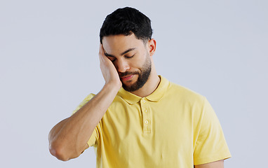 Image showing Stress, burnout and a young asian man in studio isolated on a white background for mental health. Anxiety, headache and the hands of a sad person on his face in frustration for worry or a mistake