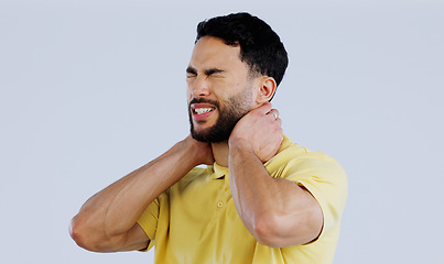 Image showing Neck pain, stress and man in studio with tired joints, arthritis risk and burnout on white background. Sick indian model, injury and massage muscle for first aid, emergency or frustrated with fatigue
