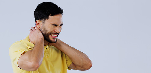 Image showing Neck pain, stress and man in studio at space with tired joints, arthritis risk or burnout on white background. Indian model, injury and massage muscle for first aid, emergency or frustrated at mockup