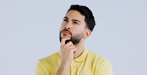 Image showing Man, confused and thinking in studio of ideas, choice and dont know why on white background. Indian model daydream of decision, remember memory or planning solution, questions and brainstorming emoji