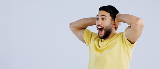 Image showing Announcement, news and man with surprise, happiness and opportunity on a white studio background. Person, guy and model shocked, discount deal and emoji with mockup space, wow and omg with reaction
