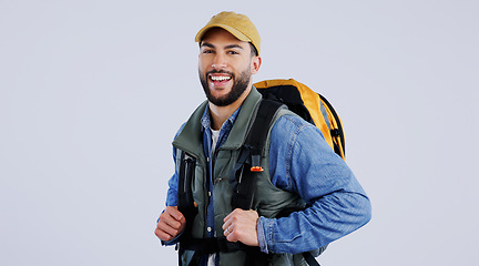 Image showing Happy man, portrait and backpack on mockup for hiking, adventure or travel against a studio background. Male person, model or hiker smile with bag for trekking journey, exercise or outdoor fitness