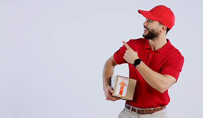 Image showing Man, courier and pointing with delivery in studio with mock up for offer on white background in Mexico. Male model, hand and gesture for announcement, promotion or notification in space for logistics