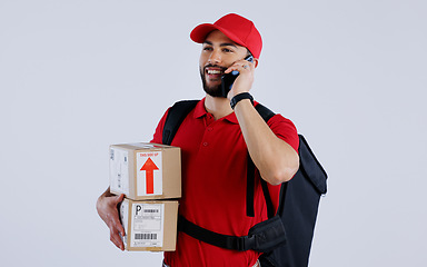 Image showing Courier man, phone call and box in studio with contact for location, direction and supply chain by background. Logistics expert, smartphone and backpack with cardboard package, product and thinking