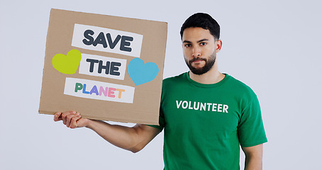 Image showing Volunteer man, poster and studio portrait to save the planet in global warming, crisis or ecology by background. Person, social responsibility and cardboard sign for sustainability for climate change