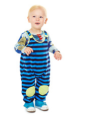 Image showing Baby, boy and toddler in studio with fashion, style and grow with curiosity, happiness and excited for kindergarten. Child, smile and standing in white background in jumpsuit, outfit and clothes