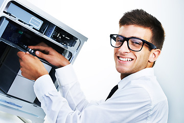 Image showing Computer tower, portrait and happy man repair studio hardware, electronics or check electrical machine. System maintenance expert, happiness and IT support fixing tech equipment on white background