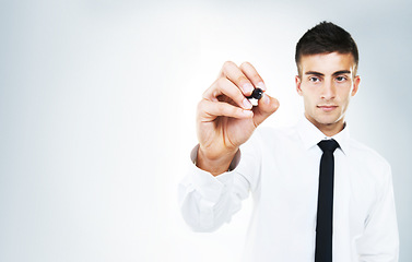 Image showing Pen, ideas and hand of businessman writing in studio, white background and invisible whiteboard. Man, planning and notes for strategy, problem solving and working with inspiration mockup space