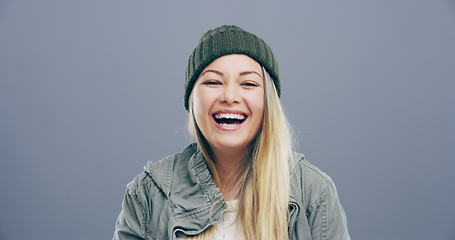 Image showing Face, fashion or happy woman in studio laughing at joke or crazy comedy isolated on gray background. Funny, model or cool female person with freedom, silly smile or joy to relax alone with humor