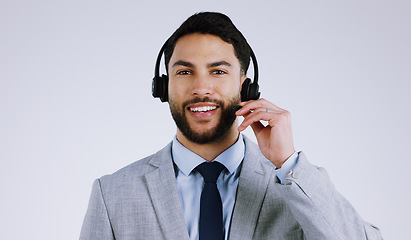 Image showing Business man, call center and headphones for communication, customer support and e commerce service in studio. Portrait of Mexican consultant or agent for contact us isolated on a white background