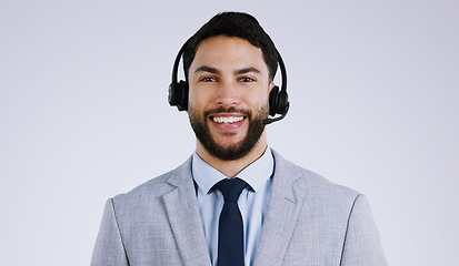 Image showing Business man, call center and portrait for communication, customer support and e commerce service in studio. Face of consultant or agent with headphones for contact us isolated on a white background