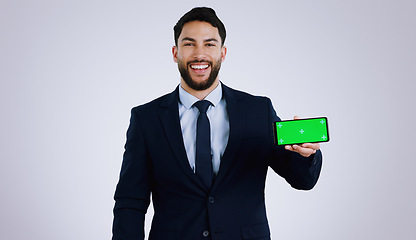 Image showing Professional man, mobile green screen and space for social media, software or online subscription in studio. Portrait of business worker on phone, website mockup or contact info on a white background