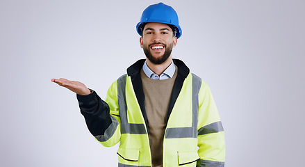 Image showing Happy man, portrait and architect with palm for advertising or marketing against a gray studio background. Male person, contractor or engineer smile with hand out for deal or service in construction