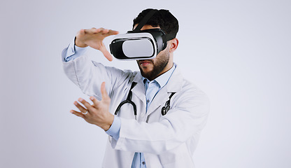 Image showing Man, doctor and VR or futuristic glasses with healthcare software, metaverse vision and user experience in studio. Medical worker with 3d exam and hands for virtual reality tech on a white background