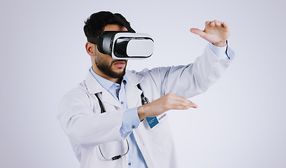 Image showing Man, doctor and virtual reality glasses for healthcare software, metaverse and futuristic user experience in studio. Medical worker watch in 3d vision, hands and VR technology on a white background