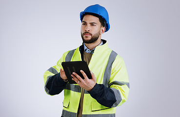 Image showing Engineering, man and tablet for inspection, thinking of renovation or project management on a white background. Construction worker for architecture survey, planning and digital technology in studio